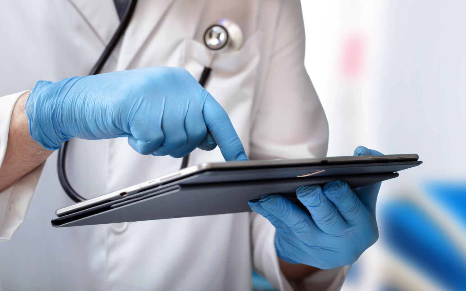 Doctor on a tablet wearing gloves
